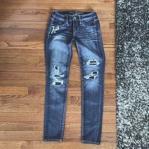American Eagle ripped jeggings. Size 4 regular mid rise. Good condition.